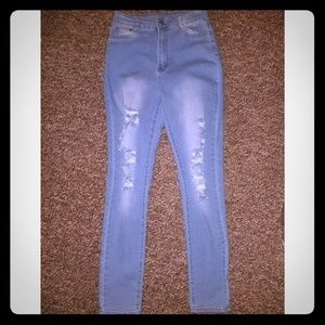 Ripped straight leg light blue jeans w/ white fade